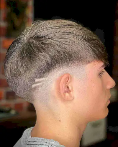 Low Fade with Shaved Lines and Fringe