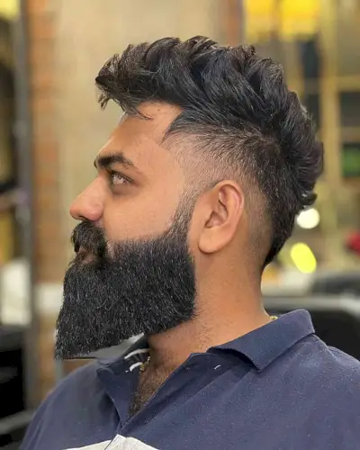 Low Fade with a Layered Long Top for Men with beards