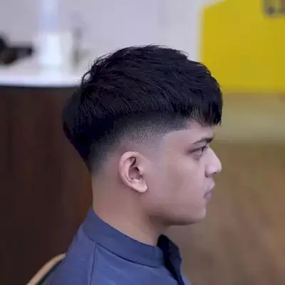 Low Fade Haircut with Flat Fringe for Men with Dense Hair