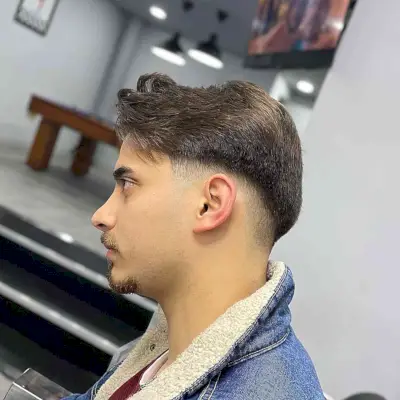 Low Fade Cut and Loose Texture Style for Thick-Haired Men with Facial Hair