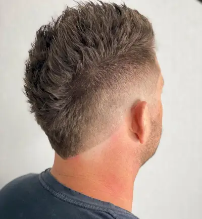 Faux hawk and mid fade cut for thin hair