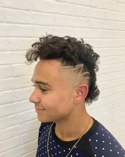 Long Faux Hawk Hairstyle with Shaved Design