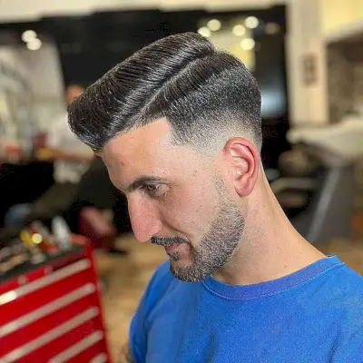 Side-Parted Pompadour with a Mid Fade for Thick-Haired Men