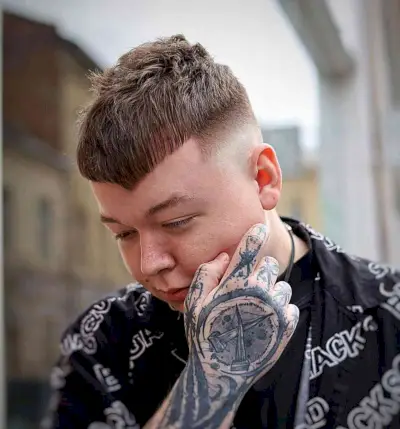 V-Shaped Bangs and a Skin Fade for Men with a funky style