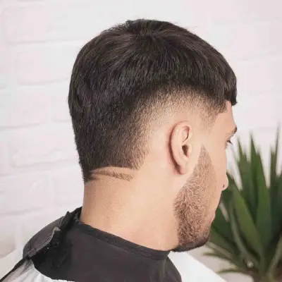 Shaved hair design with skin burst fade cut