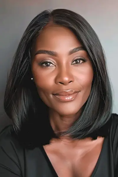 60歳以上の女性のための滑らかなストレートミディアムボブのミディアムレングスのヘアスタイル。