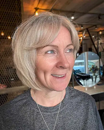 Short Layered Bob with Curtain Bangs for Older Women Past 50 with Fine Hair