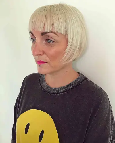 Short-Medium Cut with Brow-Skimming Bangs