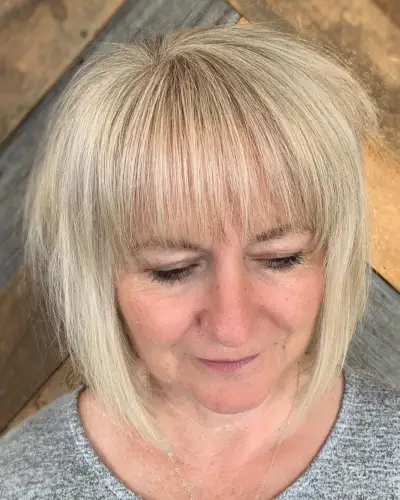 Medium to Short Haircut with Bangs for Ladies 50 and Over