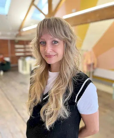 Wavy Long Hair with Shaggy Layers and Bangs for Women Over 40