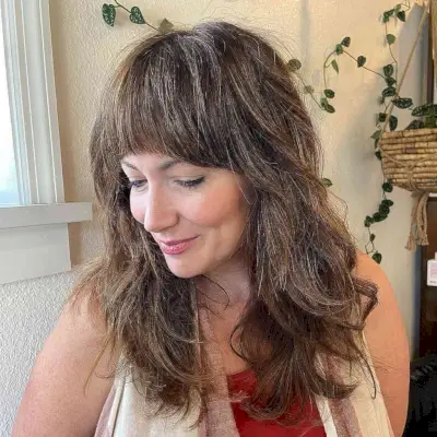 Layered Shag Cut with Full Bangs for Ladies Forty and Up