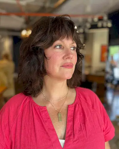 Medium Shaggy Layers with Subtle Waves on Older Women Over 40