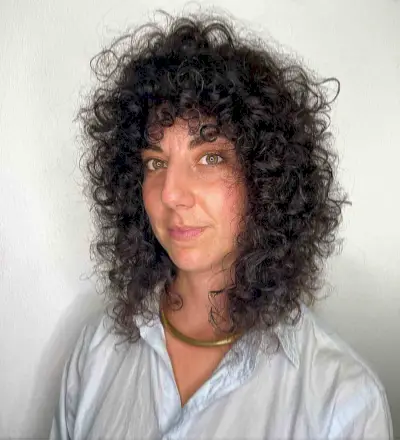 Shoulder-Length Curly Shag for a Lady in Her 40s