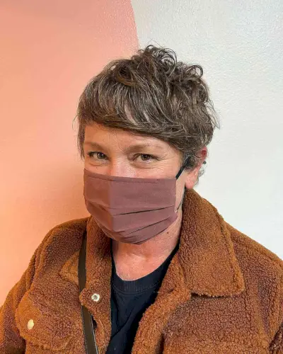 Tousled Pixie Shag with Side-Swept Bangs for an Old Woman