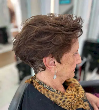 Brunette Pixie with Messy Layers for grandmas over 60 with thick hair