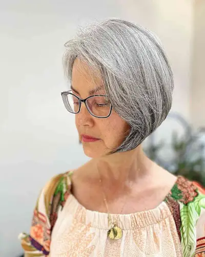 Chin-Length Grey Bob with Side Part for Women Aged 60 with Thick Tresses