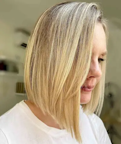 Medium-Length Bob Cut with a Side Part for a Woman Over 40
