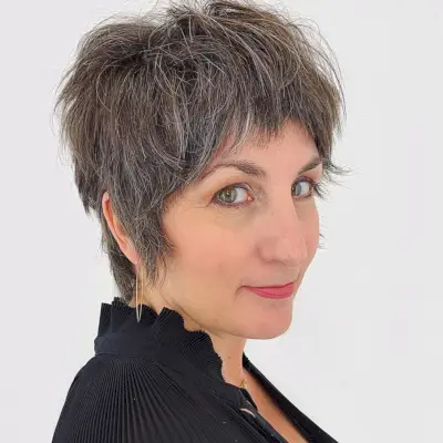 Neck length shag cut for a woman in her 50s and fine hair