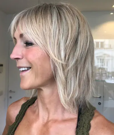 woman over 50 with choppy layered cut shag