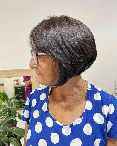 Chin-Length Graduated Bob Cut with Side Bangs for 60-year-olds with Glasses