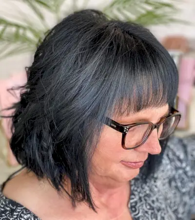 Layered bob for 60-year-old women with glasses