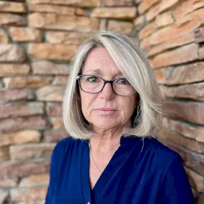 rounded bob cut for 60-year-olds with glasses