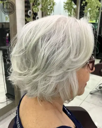 Feathered hairstyle for women over 50 with thick hair