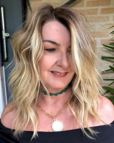 Tousled shag for women over 50 with thick medium-length hair