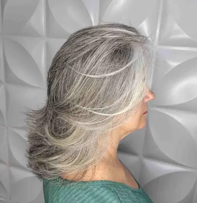 Flattering Feathered Lob with Wispy Ends for Women Over 50 with Thick Hair