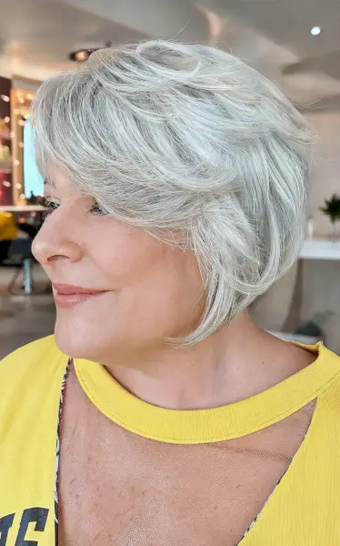 Feathered Silver Bob with Side-Swept Bangs for Women 50 and Over