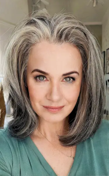 Layered long bob cut for women with salt and pepper hair