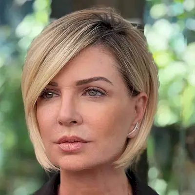 Jaw-Length Rooted Blonde Bob for For Women Over 40 with a deep side part