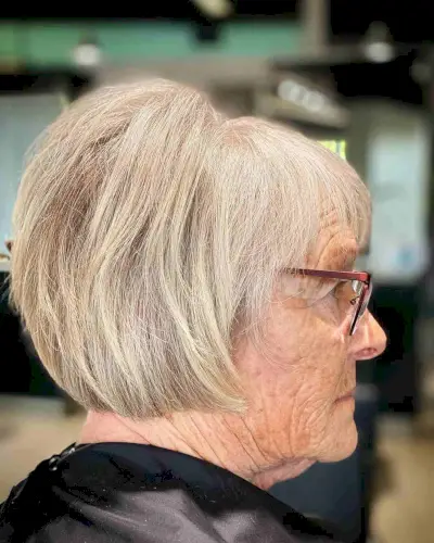 Blonde Bob with Bangs and Teased Crown for an Older Woman