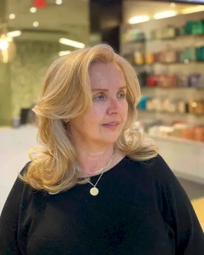 Layered Blowout Style with a Deep Side Part for Older Women