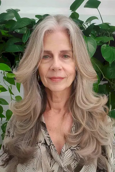 Layered hair with a middle part for women over 60