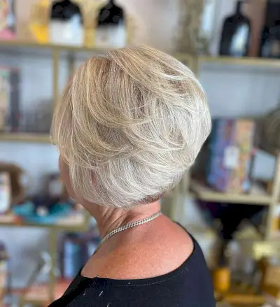 Low-Maintenance Short Feathery Wedge Cut for Ladies Over Sixty with Fine Hair