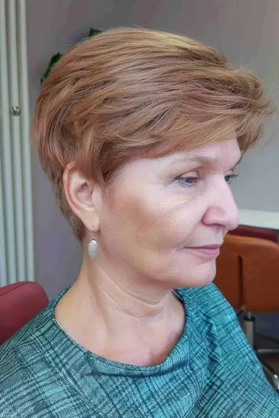 Short feathered layers hairstyle for mature women over 50