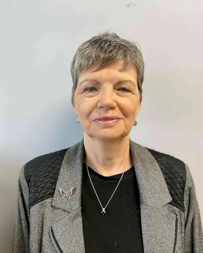 Low-Maintenance Razor Cut Pixie with Bangs for Older Women Past 50 with Grey Hair