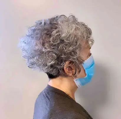 Curly Wedge Crop for a 70-Year-Old Woman