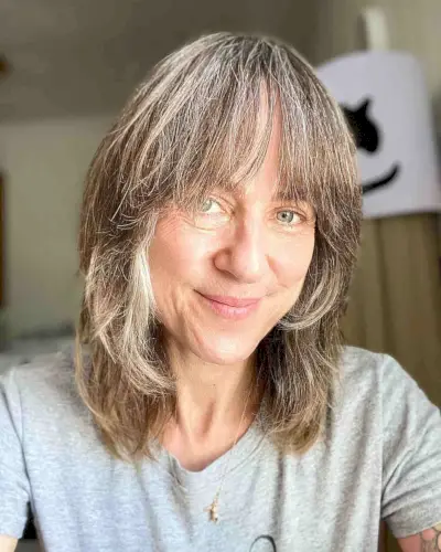 Collarbone-Length Razored Shag with Bangs for Ladies Over Fifty