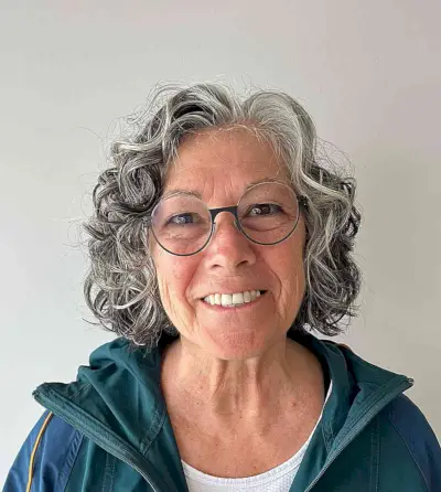 Beautiful Natural Curls and Cut for Women Aged 50 with Glasses