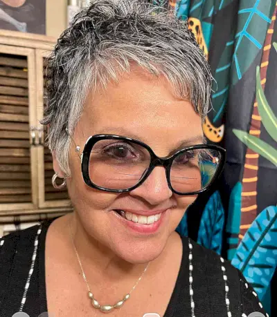 Naturally Grey Pixie Cut for Women Aged 50 with Eyeglasses and a sweeping fringe