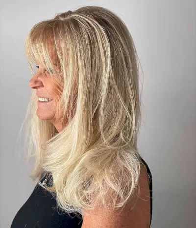 Long-Length Vanilla Blonde Hair with Front Bangs for Older Ladies Aged 50