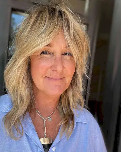 Mid-Length Classic Soft Shag for Ladies 50 and Over with blonde hair