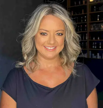 Shoulder-Length Loose Blonde Curls for Ladies Over Fifty