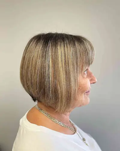 Caramel Balayage on a Short Bob with Bangs for Ladies Over 60