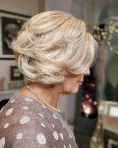Timeless Short-Length Feathered Hair for a Lady in Her 70s
