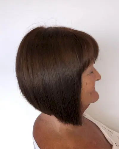 medium length cut for woman over 70 with dark brown hair