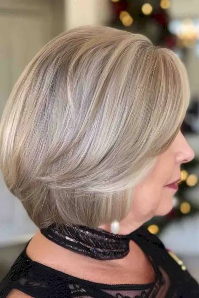 Elegant ash gray inverted bob on a woman over 50