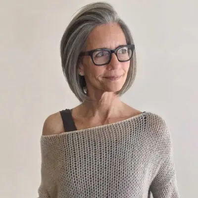 Short grey-haired bob for older women with glasses